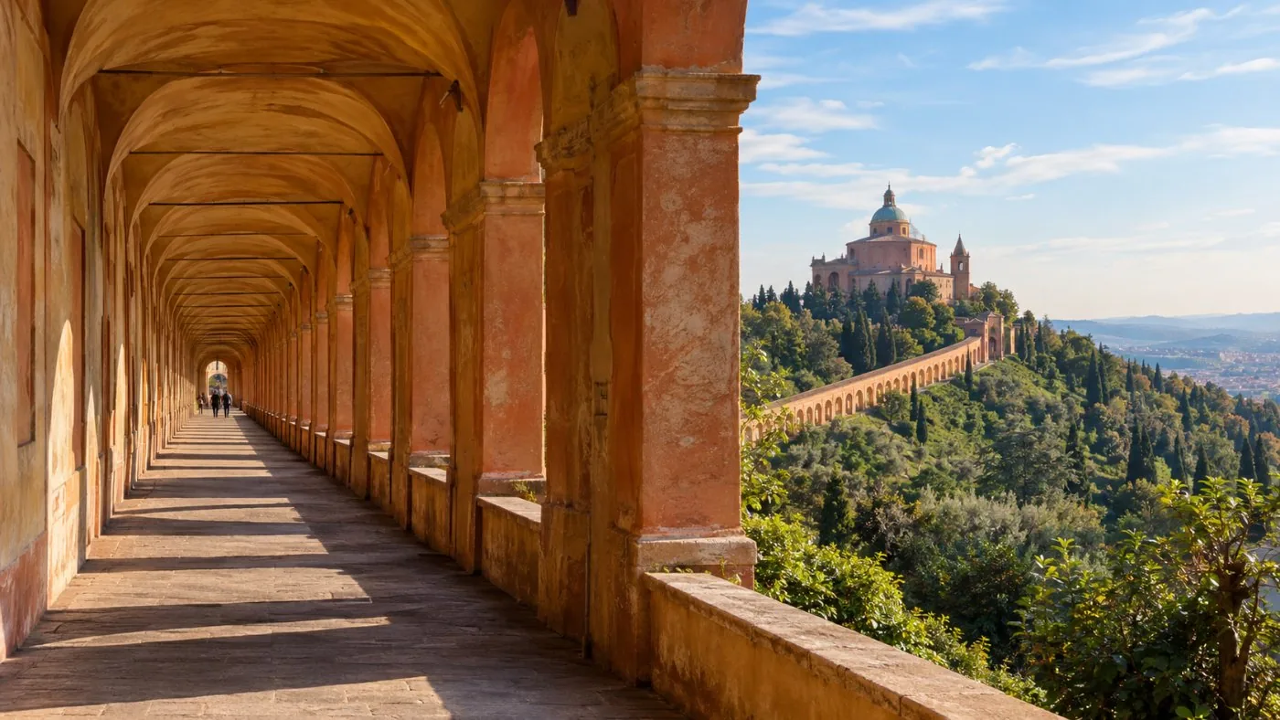 A long arched portico climbing a green hill toward a sanctuary